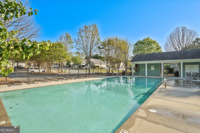 384 Parc River Blvd, Lawrenceville, GA 30046 - community pool featuring a patio