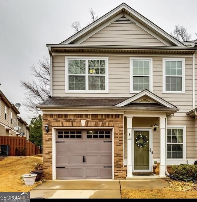 7750 Carnegie Dr, Fairburn, GA 30213 - view of front of house with fence, driveway, and a garage