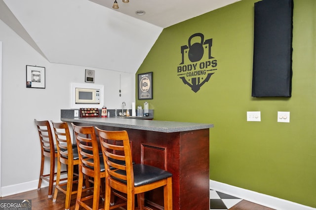 207 Jamestown Ave, Jonesboro, GA 30236 - indoor wet bar featuring white microwave and lofted ceiling