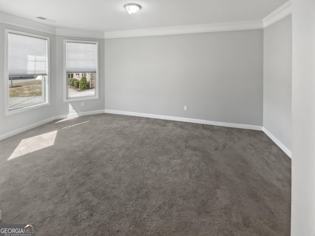 2470 Bridle Bridge Trl, Cumming, GA 30040 - unfurnished room featuring visible vents, baseboards, dark carpet, and crown molding