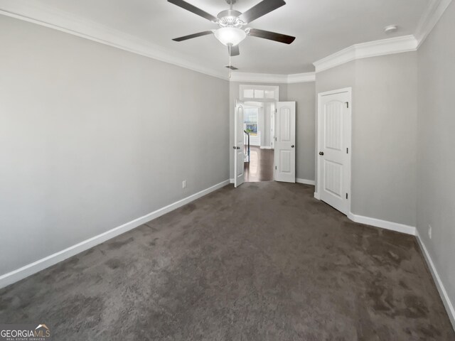 2470 Bridle Bridge Trl, Cumming, GA 30040 - unfurnished bedroom with dark colored carpet, crown molding, baseboards, and ceiling fan