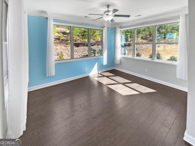 2470 Bridle Bridge Trl, Cumming, GA 30040 - unfurnished room featuring visible vents, baseboards, dark wood-style floors, and ceiling fan