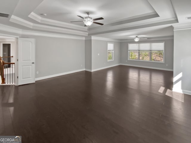 2470 Bridle Bridge Trl, Cumming, GA 30040 - unfurnished living room with ceiling fan, baseboards, a tray ceiling, and visible vents