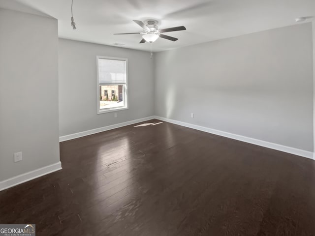 2470 Bridle Bridge Trl, Cumming, GA 30040 - unfurnished room with dark wood-type flooring, a ceiling fan, and baseboards
