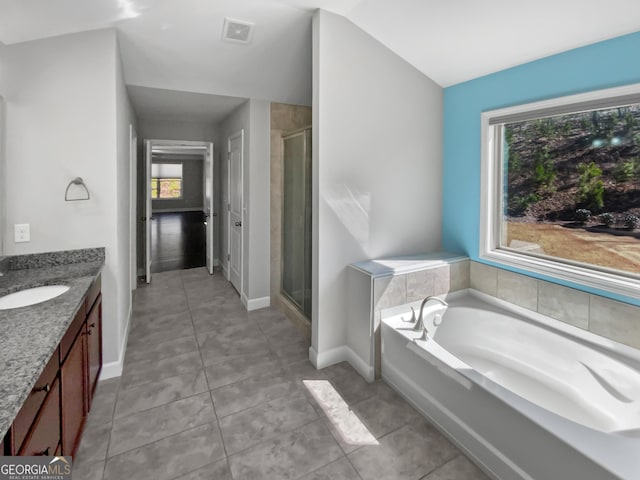 2470 Bridle Bridge Trl, Cumming, GA 30040 - full bath featuring a bath, a stall shower, baseboards, visible vents, and vanity