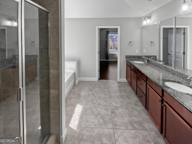 2470 Bridle Bridge Trl, Cumming, GA 30040 - bathroom with a bath, double vanity, a shower stall, and a sink