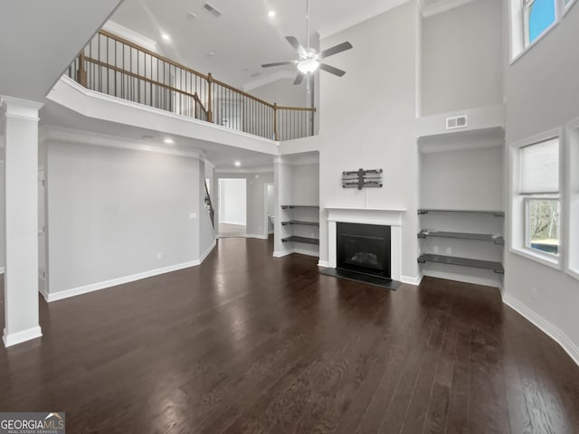 2470 Bridle Bridge Trl, Cumming, GA 30040 - unfurnished living room with a high ceiling, a wealth of natural light, ceiling fan, and visible vents