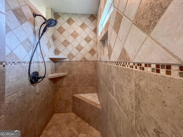 bathroom featuring a tile shower