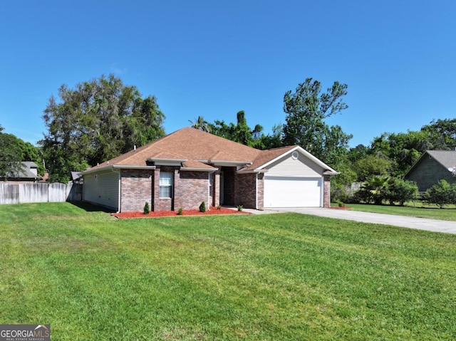 ranch-style home featuring driveway, fence, a garage, brick siding, and a front yard