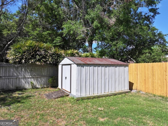 view of shed featuring a fenced backyard