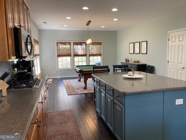 kitchen with recessed lighting, pool table, a kitchen island, dark wood-style flooring, and black microwave