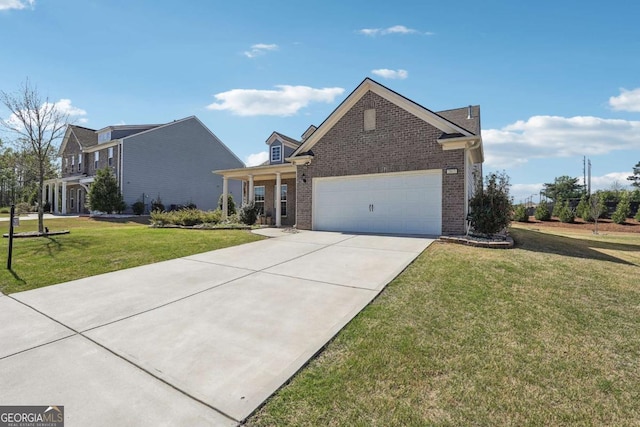 2815 Paddle Point Ln, Cumming, GA 30041 - view of front of home featuring concrete driveway, a front lawn, brick siding, and a garage