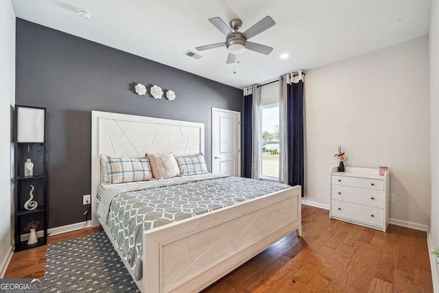 2815 Paddle Point Ln, Cumming, GA 30041 - bedroom featuring wood finished floors, visible vents, a ceiling fan, and baseboards
