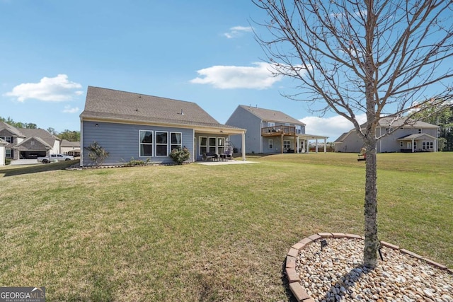 2815 Paddle Point Ln, Cumming, GA 30041 - rear view of property featuring a patio area and a yard