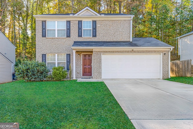 traditional-style house featuring fence, concrete driveway, a front yard, and brick siding
