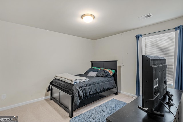 bedroom featuring visible vents, carpet, and baseboards