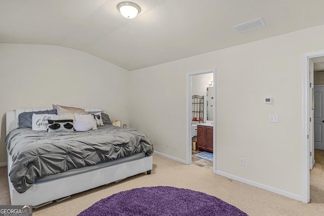 bedroom featuring baseboards, light carpet, vaulted ceiling, and visible vents
