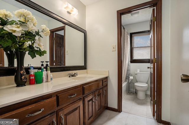 full bath featuring vanity, toilet, tile patterned floors, baseboards, and shower / tub combo with curtain