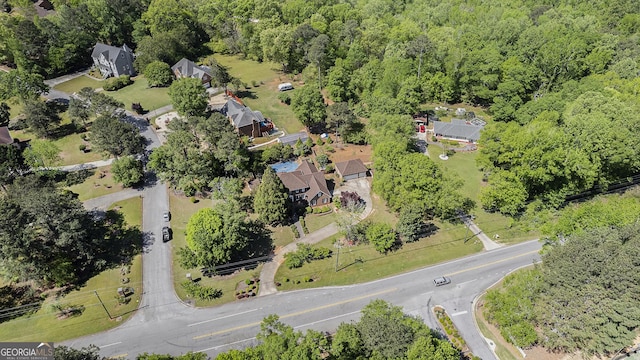 aerial overview of property's location with a forest