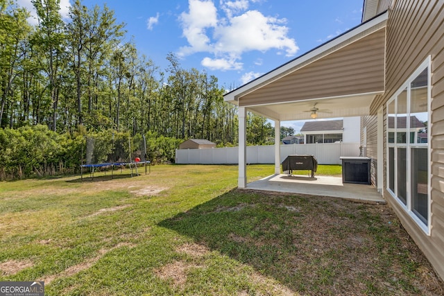 240 Daniel Trent Way, Kingsland, GA 31548 - view of yard with a trampoline, a patio area, and a ceiling fan