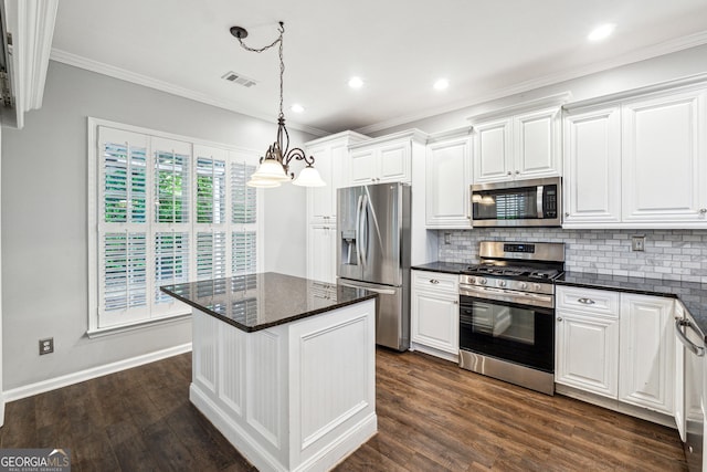 3911 Delfaire Trce, Cumming, GA 30040 - kitchen with stainless steel appliances, white cabinetry, decorative backsplash, ornamental molding, and dark wood-style floors