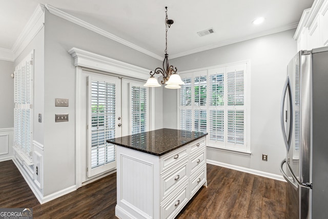 3911 Delfaire Trce, Cumming, GA 30040 - kitchen featuring freestanding refrigerator, a chandelier, ornamental molding, dark wood-type flooring, and white cabinetry