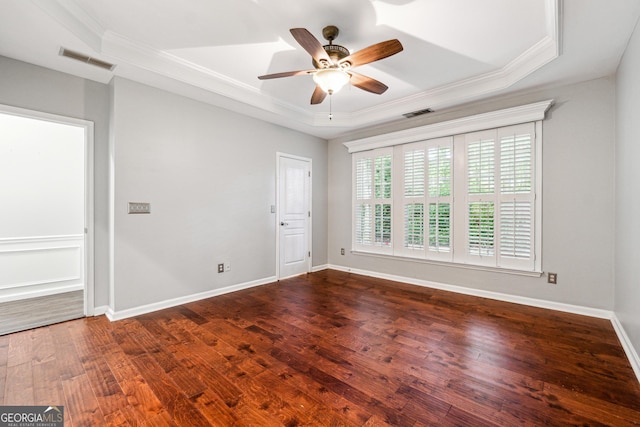 3911 Delfaire Trce, Cumming, GA 30040 - spare room with a raised ceiling, ornamental molding, dark wood finished floors, ceiling fan, and baseboards
