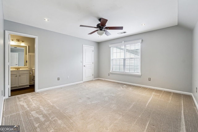 3911 Delfaire Trce, Cumming, GA 30040 - unfurnished bedroom with light colored carpet, baseboards, ensuite bathroom, a sink, and vaulted ceiling