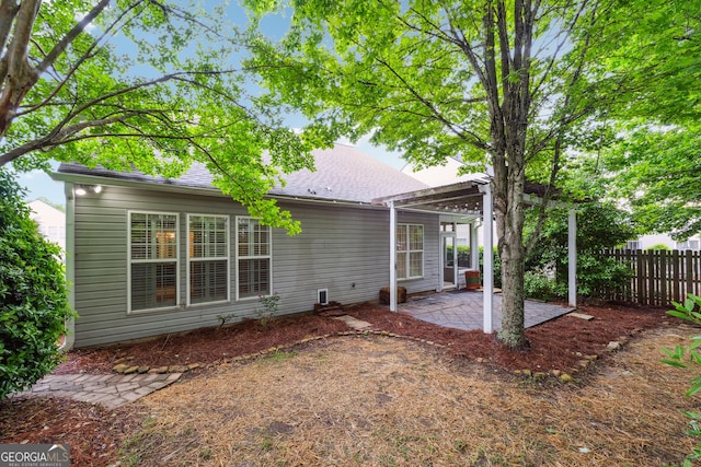 3911 Delfaire Trce, Cumming, GA 30040 - rear view of house featuring a patio area, fence, and roof with shingles