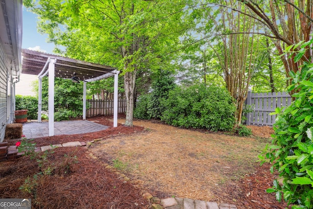 3911 Delfaire Trce, Cumming, GA 30040 - fenced backyard featuring ceiling fan and a patio