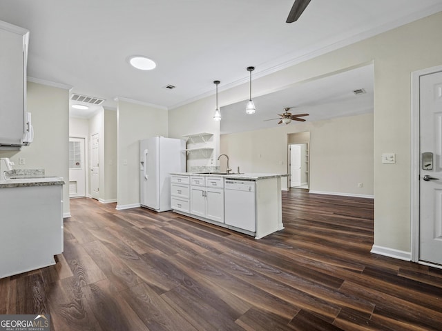 181 Bagley Rd, Eatonton, GA 31024 - kitchen with dark wood finished floors, visible vents, white appliances, crown molding, and ceiling fan
