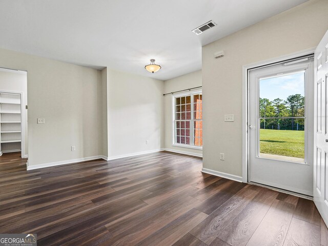181 Bagley Rd, Eatonton, GA 31024 - interior space featuring a wealth of natural light, dark wood-type flooring, visible vents, and baseboards