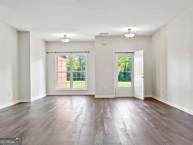 181 Bagley Rd, Eatonton, GA 31024 - interior space featuring visible vents, baseboards, and dark wood-style floors