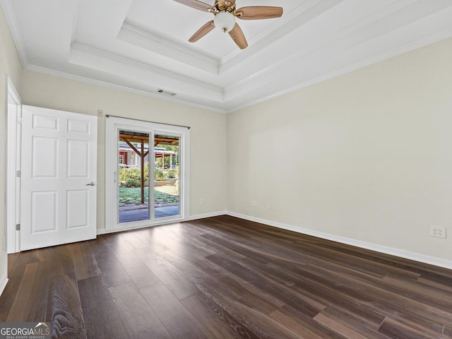 181 Bagley Rd, Eatonton, GA 31024 - empty room featuring crown molding, ceiling fan, a tray ceiling, baseboards, and dark wood-type flooring