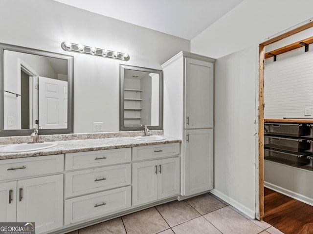 181 Bagley Rd, Eatonton, GA 31024 - full bath with double vanity, tile patterned flooring, and a sink