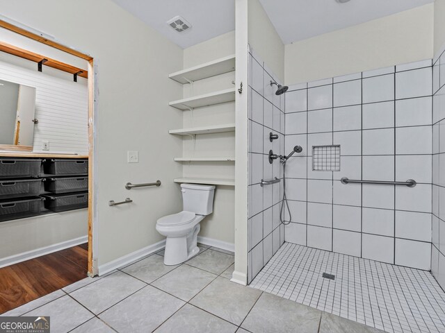 181 Bagley Rd, Eatonton, GA 31024 - full bath with a tile shower, toilet, tile patterned flooring, and visible vents