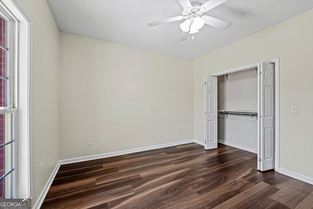 181 Bagley Rd, Eatonton, GA 31024 - unfurnished bedroom with dark wood finished floors, baseboards, a ceiling fan, and a closet