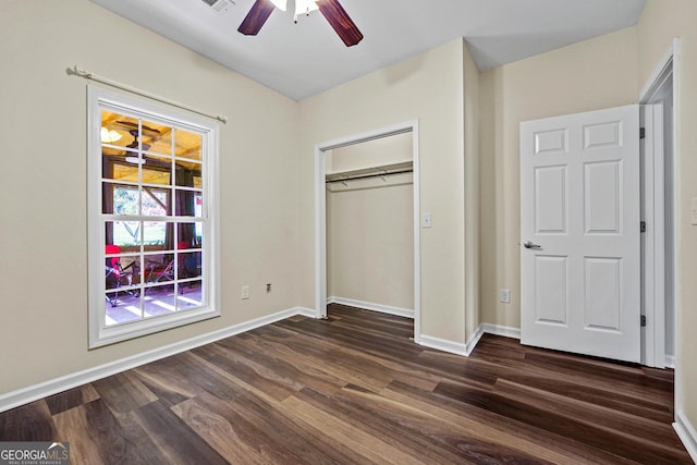 181 Bagley Rd, Eatonton, GA 31024 - unfurnished bedroom featuring baseboards, dark wood-style floors, and a closet
