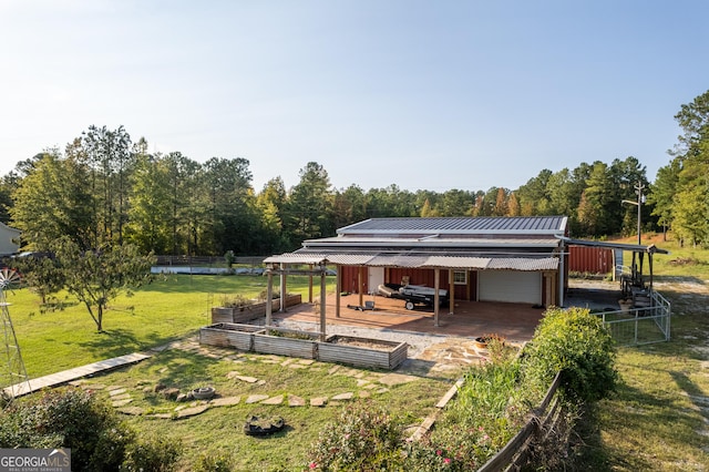 181 Bagley Rd, Eatonton, GA 31024 - exterior space with fence, a patio area, and a garden
