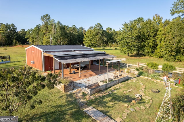 181 Bagley Rd, Eatonton, GA 31024 - view of outdoor structure with fence, a vegetable garden, and an outdoor structure