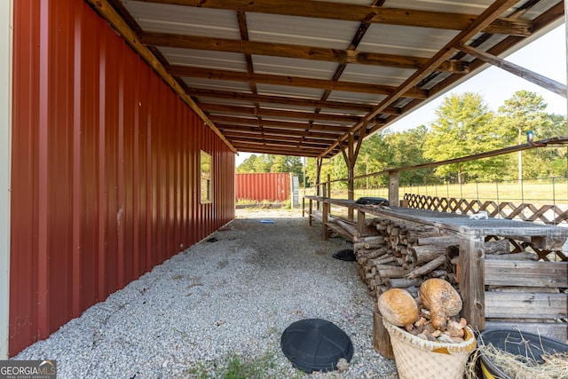 181 Bagley Rd, Eatonton, GA 31024 - view of patio featuring a carport, an outbuilding, and an exterior structure
