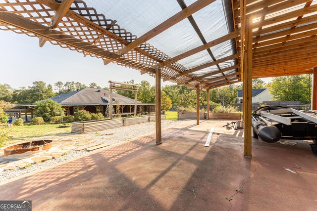 181 Bagley Rd, Eatonton, GA 31024 - view of patio with a pergola and an outdoor fire pit