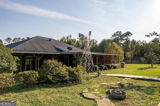181 Bagley Rd, Eatonton, GA 31024 - rear view of house featuring a yard and fence