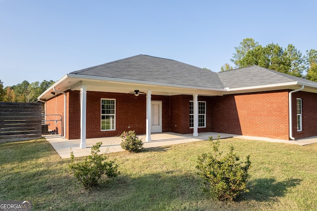181 Bagley Rd, Eatonton, GA 31024 - view of front of house with a front lawn, fence, brick siding, ceiling fan, and a patio
