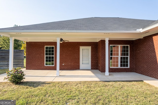 181 Bagley Rd, Eatonton, GA 31024 - back of property featuring a patio area, a lawn, fence, brick siding, and ceiling fan