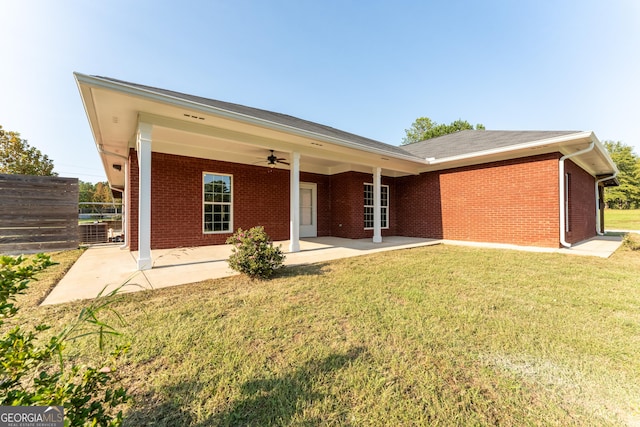 181 Bagley Rd, Eatonton, GA 31024 - rear view of house with a ceiling fan, brick siding, a yard, and a patio