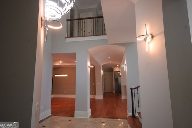 6509 Lily Trl, Fairburn, GA 30213 - tiled foyer entrance featuring arched walkways and a high ceiling