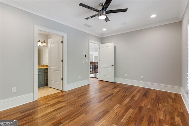 6509 Lily Trl, Fairburn, GA 30213 - unfurnished bedroom featuring light wood-type flooring, crown molding, recessed lighting, ensuite bath, and ceiling fan