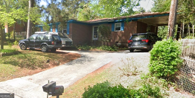3033 Manchester Dr, Macon, GA 31206 - view of front of home featuring brick siding and driveway