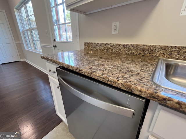 417 Bell Flower Trl, Locust Grove, GA 30248 - kitchen featuring dark wood-type flooring, white cabinets, stainless steel dishwasher, and dark stone countertops